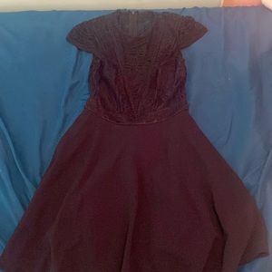A kids size small black and blue dress